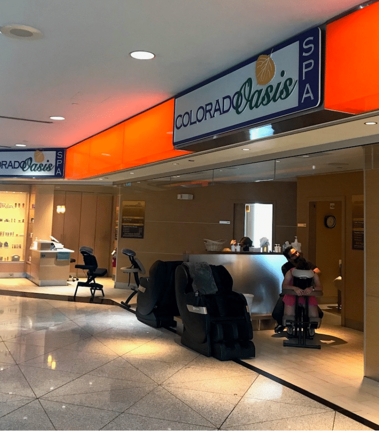 a lobby with a sign and chairs