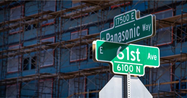 Apartments under construction with 61st ave and Panasonic way street signs
