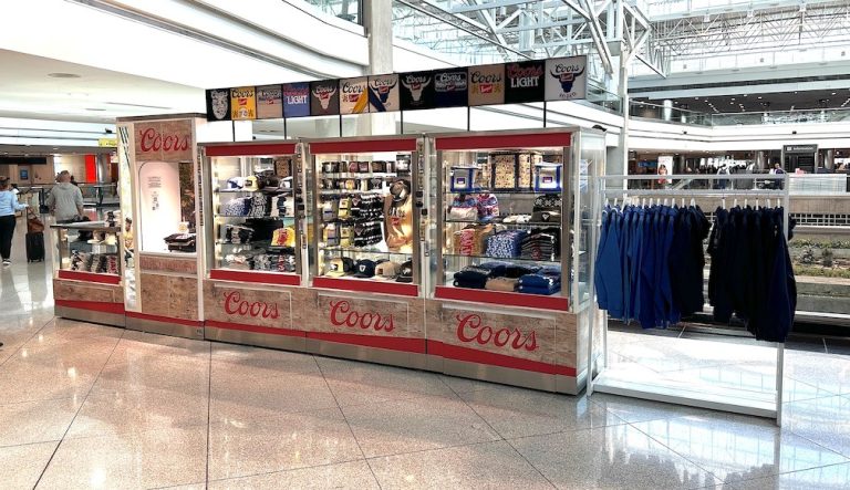 The Coors x Colorado Unlimited kiosk is on C Gates