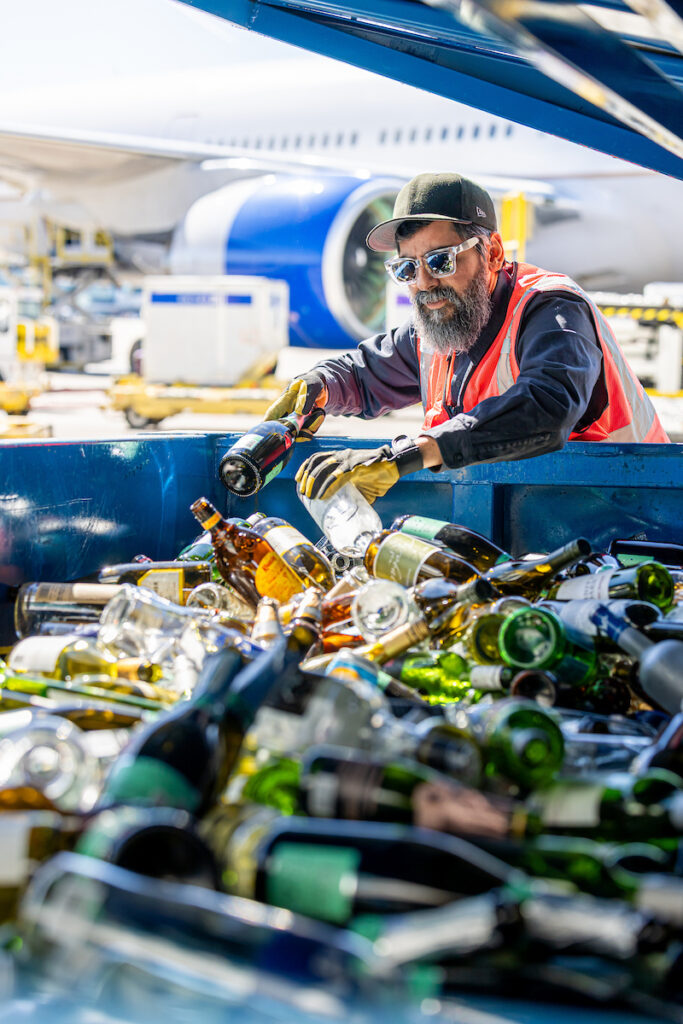 DEN staff sort recyclable waste