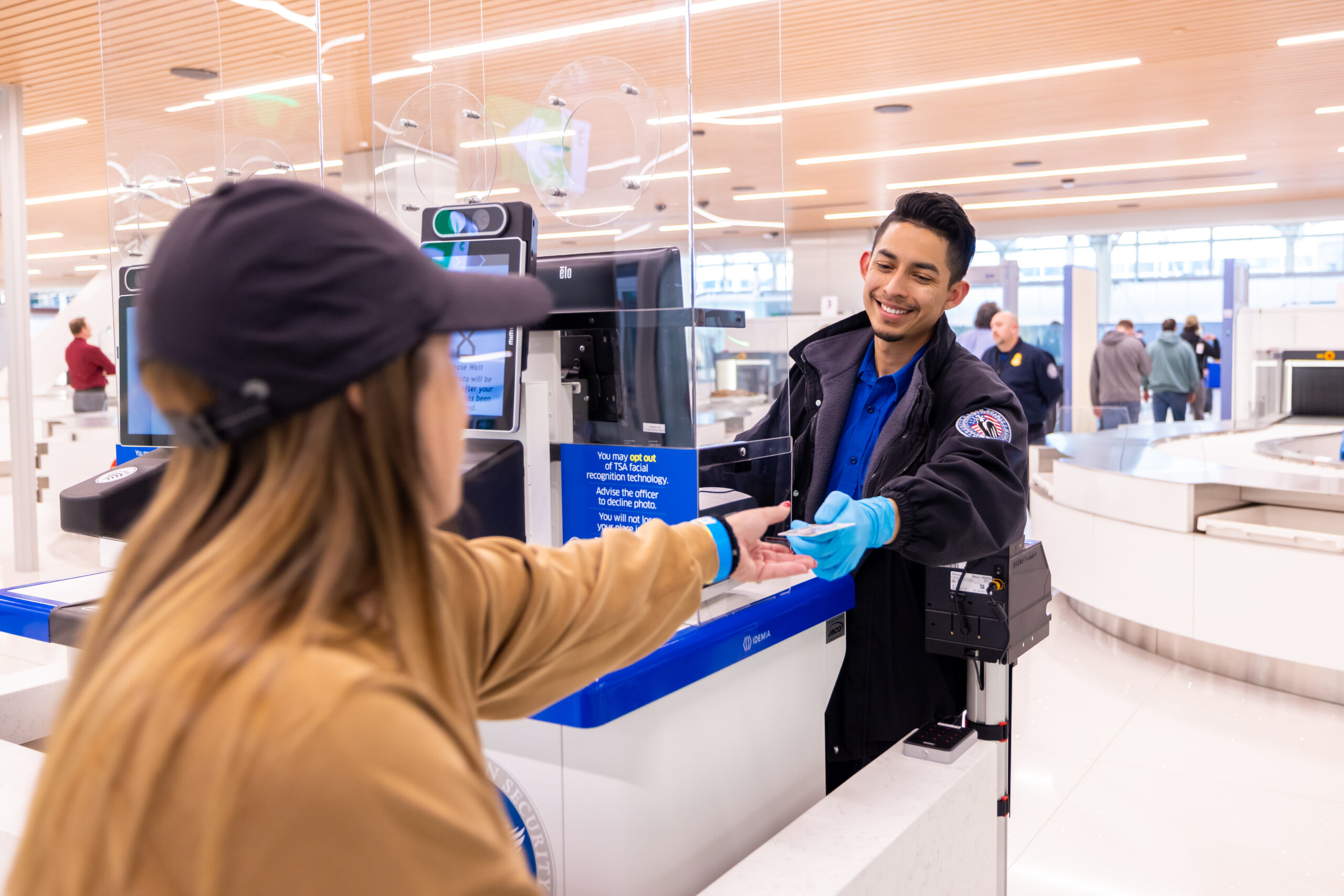 A traveler is screened at DEN's new west Security Checkpoint